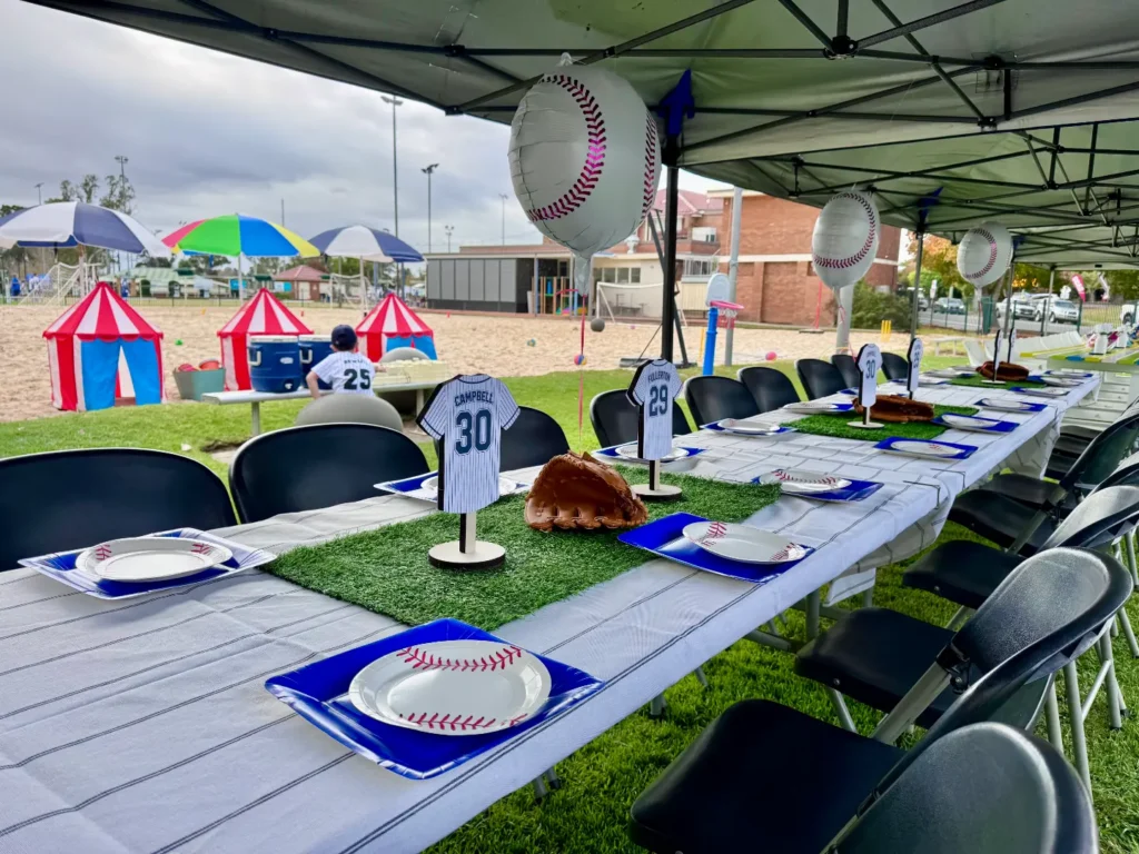 Beach party kids party with tables, chairs, and decorations.