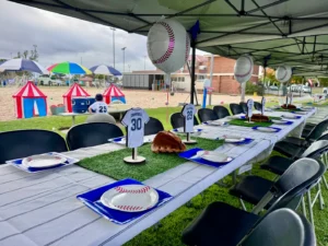 Beach party kids party with tables, chairs, and decorations.